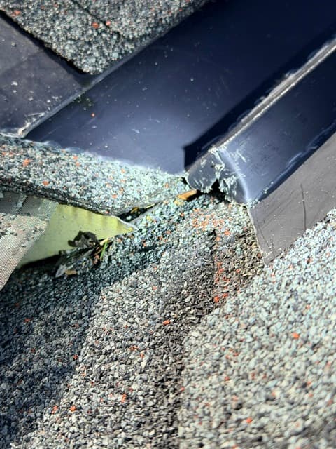 Roof flashing and shingle damage
