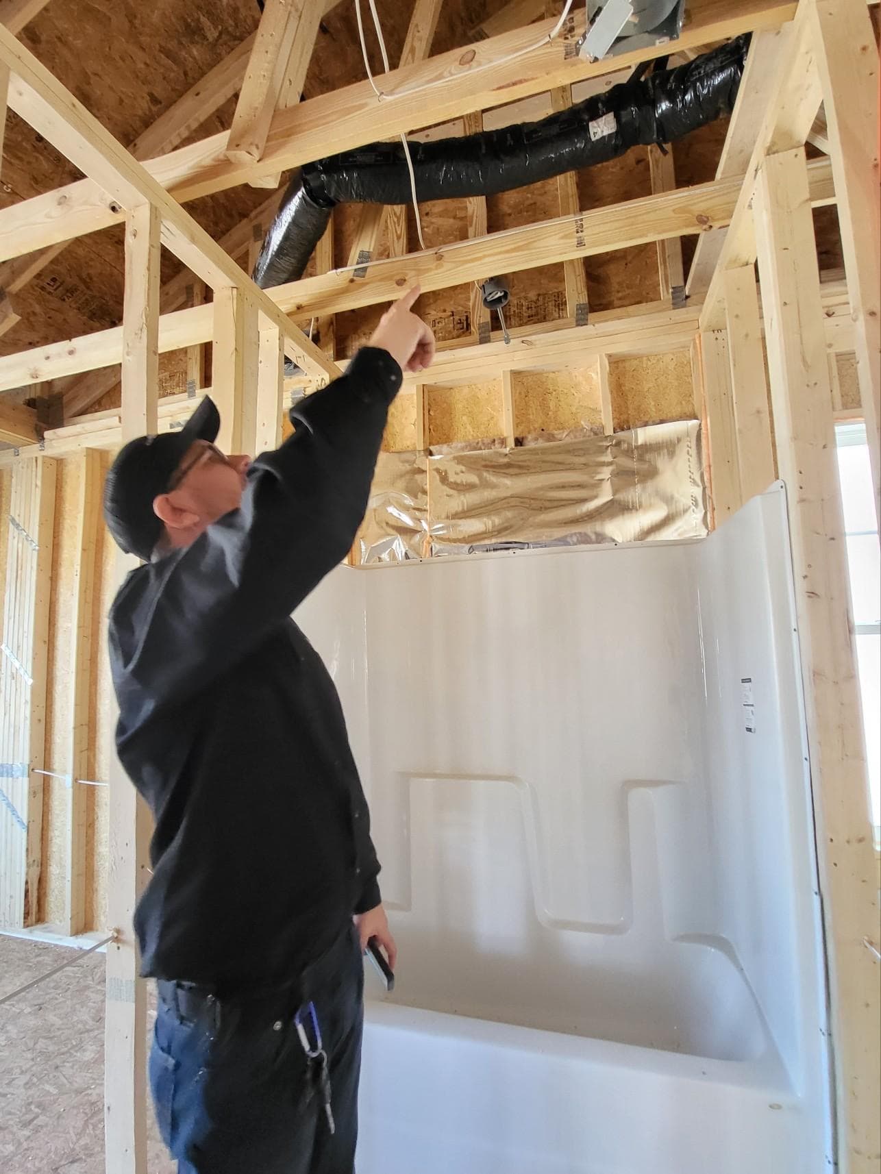 Dean inspecting overhead ductwork