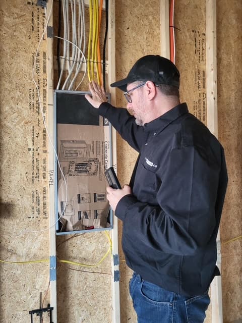 Dean inspecting electrical panel