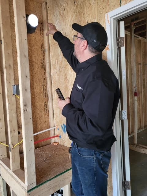 Dean inspecting pre-drywall structure