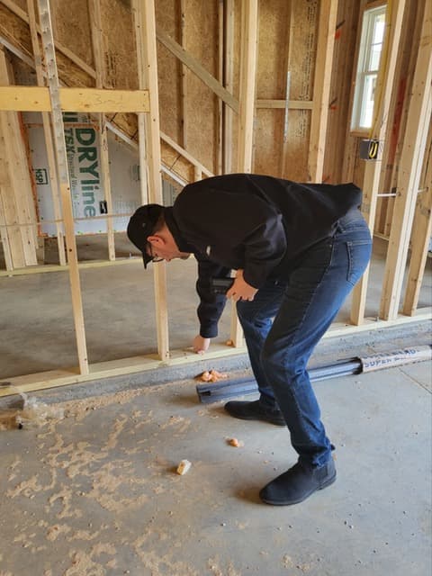 Dean checking framing and plumbing layout